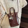 Bolso Pequeño Retro para Mujer Verano 2025 Nueva Moda Bolso Cubo de Gama Alta Versátil Cruzado para Teléfono Móvil Bolso de Hombro