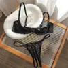 Conjunto de lencería de encaje estilo francés de media copa para mujer, con aros para soporte, efecto push-up, cobertura lateral del busto, tirantes finos ajustables y diseño calado.