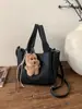 Bolso Cubo de Mano de Moda para Mujer Otoño e Invierno 2025 Nuevo Bolso de Hombro Sencillo Estilo Coreano Nicho de Gama Alta Casual Bolso para Mujer