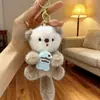Lindo Peluche de Nutria Colgante con Pez, Llavero para Bolso de Castor, Adorno de Muñeco, Nutria Marina Sosteniendo un Pez