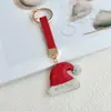 Sombrero, calcetín, llavero, colgante, decoración de bolsa de Papá Noel, muñeco de nieve, llavero de coche de la serie navideña con incrustaciones de arcilla y diamantes