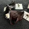 Bolso de mano para mujer transfronterizo, bolso de mamá para mujer de mediana edad, nuevo estilo 2026, gran capacidad, bolso de hombro simple, bolso cruzado de alta gama, moderno