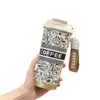 Taza térmica muy elegante para viajes y uso en la oficina, revestimiento interior de acero inoxidable 316, opción de doble bebida, con correa de asa, personalizable, taza de café al por mayor