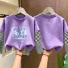 Camiseta infantil para otoño, top de algodón puro para niños, camiseta de manga larga tipo dos piezas falsas, ropa infantil de otoño, nuevo estilo casual 2026