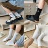 Calcetines de algodón para hombre y mujer, con dibujos animados en blanco y negro, de longitud media, bordados para parejas, para estudiantes, para combinar con todo, de caña alta, deportivos, de moda.