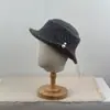 Nuevo sombrero de pescador de punto calado vintage para mujer, elegante y que adelgaza la cara, con decoración de perlas, versátil y elegante