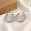 Aretes de aro trenzados multicapa para mujer, simples y versátiles, adecuados para el uso diario, con un estilo fresco y elegante, hechos de acero de titanio en color plateado