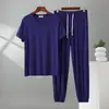 Nuevo conjunto de ropa de casa para hombre, talla grande, corte holgado, top de modal fino de manga corta con cuello en V y pantalones largos con puño, conjunto de dos piezas