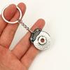 Accesorios de modificación de coche transfronterizos, pequeño regalo para hombre, amortiguador de metal, colgante de neumático, llavero de cubo de rueda al por mayor