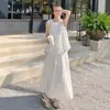 Chal sin mangas con lazo tridimensional de la primavera de 2026 Vestido falso de dos piezas