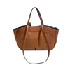 A bolsa balde retrô popular deste ano para mulheres, novo modelo outono 2026, apresenta um design de patchwork texturizado, bolsa de ombro versátil e bolsa de axila