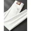 Jeans Elásticos Ajustados de Lujo Ligero Estilo Europeo de Gama Alta Blancos Resistentes al Agua para Hombre, Versión Gruesa para Otoño e Invierno 2026
