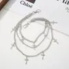 Exquisito Colgante de Cruz en Relieve Cadena de Cintura Multicapa con Cadenas de Textura Mixta Brillantes en Tonos Fríos Cadena de Pantalones Cargo Estilo Y2K Americano