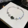 ¡Joyería de cadena colorida! Pulsera ovalada de circonita súper brillante, sensación de lujo ligero y alta gama, joyería versátil y exquisita para mujer al por mayor