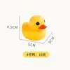 Juguetes de baño para niños de pato amarillo pequeño al por mayor Juguetes de pato pequeño de vinilo para llamar pellizcando agua de bebé para niños Juguetes de pato pequeño para nadar