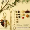 Kit de material DIY para fazer um móbile de casca de fruta, um sino pendurado de cura, com frutas pretas indonésias, estramônio, lírio d'água e rotim