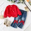 26 Nueva colección de otoño y primavera para exportación: Sudaderas con moño para niños + Pantalones acampanados de mezclilla retro, elegantes y modernos, al por mayor
