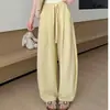 Pantalones de pierna ancha finos de moda versátiles para principios de otoño con cordón cintura elástica pantalones simples de cintura alta adelgazantes pantalones curvos pantalones casuales para mujer