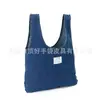 Bolso de mano de mezclilla casual de moda creativa, bolsa de compras de mezclilla simple de protección ambiental, bolsa de mano