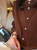 Vibe vintage old money~Camisa de veludo cotelê marrom com babados para mulheres, início do outono de 2026, camisa elegante para o trabalho
