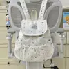 Mochila con tiras de lunares y lazo, estilo universitario para mujer, adecuada para ir al trabajo, viajes casuales y una mochila pequeña para el uso diario