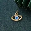 Colgante de joyería de ojo de diablo con incrustaciones de diamantes nuevo transfronterizo llavero DIY mochila colgante Joker en stock al por mayor