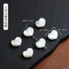 Venda direta da fábrica de acessórios de gato sem rosto de madrepérola branca natural, componentes de joias DIY para pulseira e colar perfurados semiacabados