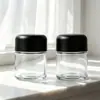 Botella de Vidrio Transparente al por Mayor de Fábrica Tapa de Seguridad para Niños Tapa de Rosca Sellada Botella de Empaque Botella para Suplementos de Salud Botella de Almacenamiento