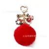 Chaveiro de Metal Criativo de Natal Transfronteiriço Pingente de Bolsa Pom-Pom Colorido Floco de Neve Elementos de Natal Ornatos Atacado