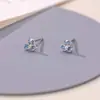 Pendientes de botón de flor de iris de lujo ligero estilo francés para mujer, temperamento de nicho, pendientes de circonita de flor azul suave, pendientes de celebridad de internet para ir al trabajo