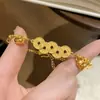 Joyería de Cobre Chapado en Oro Estilo Chino Nuevo con Monedas de los Cinco Emperadores y Pulsera de Calabaza Enrollada para Mujer, Lujo Ligero de Nicho con un Diseño de Alta Gama