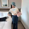 Camiseta de Hombro de Algodón Puro con Estampado de Dibujos Animados Estilo Japonés para Mujer Verano Diseño Nicho Holgada Chic Estilo de Hong Kong Top