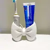 Portacepillos de dientes con forma de lazo, soporte de almacenamiento de plástico sin instalación, adorno de exhibición de bolígrafos/cepillos de dientes para baño y dormitorio