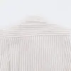 Ropa de mujer transfronteriza al por mayor 2026 otoño nuevo estilo europeo y americano versátil lazo hombreras acolchadas camisa a rayas 4764031