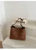 Bolso de mujer de comercio exterior nuevo, bolso cubo retro estilo coreano de gran capacidad para el día a día, bolso de hombro de nicho moderno y versátil, bolso de moda para llevar debajo del brazo