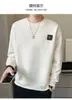 Suéter de algodón de manga larga y cuello redondo holgado para jóvenes a la moda otoño 2023 estilo coreano ligeramente ancho camiseta básica para hombre