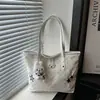 Bolso de mano lindo de lunares de gran capacidad para mujer, versión coreana, bolso tote de nicho para el día a día, bolso de hombro casual de moda para el trabajo
