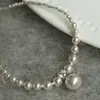 Collar de perlas de metal plateado de alta calidad para mujer, popular estilo francés, cadena para la clavícula, collar simple y versátil para el temperamento