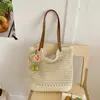 Bolso tejido transfronterizo para mujer, nuevo modelo de verano 2026, bolso de hombro para vacaciones en la playa, bolsa de mano versátil de gran capacidad para el día a día