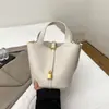 Bolso de Cubo Casual y Versátil para Llevar en la Mano 2025 Nuevo Verano Moda Coreana Bolso de Hombro Casual Bolso Cruzado de Alta Gama