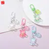 Llavero de oso de resina con lazo de color caramelo transparente, accesorio con colgante de corazón para decoración DIY hecha a mano de libros para niñas