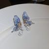 Pendientes de botón con forma de mariposa y perlas de súper hada para mujer, de diseño exquisito y moderno, de alta calidad, ligeros, de lujo y con temperamento.