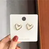 Pendientes de botón de plata de ley s925 de celebridades de internet japonesas y coreanas al por mayor, pendientes simples huecos con forma de corazón lindo, pendientes de diseño nicho
