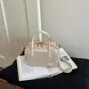 Bolsa de bolos tejida transfronteriza, diseño de nicho de lujo ligero, bolso de hombro y cruzado, bolso Boston tipo almohada de moda