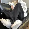 Pantalones rectos versátiles para hombre en stock, nuevos pantalones deportivos de moda para exteriores para jóvenes de otoño, de alta resistencia y forrados de polar para hombre