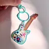 Nuevo llavero acrílico de alta calidad de suministro directo, llavero creativo de violín, colgante para bolso con impresión de logotipo