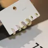 Pendientes pequeños de una semana, populares pendientes pequeños de aguja de plata S925, una tarjeta, tres pares de pendientes de combinación de traje, pendientes de circonita roja de red para mujer