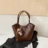 2026 Bolsa Nueva Cesta de Verduras Bolso Tote Hombro Único Gran Capacidad Para Viajar Bolso de Mano Nuevo Bolso de Mano Versátil