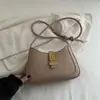 2026 Versión Coreana Nueva Moda Casual Hebilla Magnética Gran Capacidad Verano Elegante Alto Valor Bolso de Hombro Axila Cruzado para Mujer