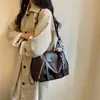 Mochila multifuncional de diseño nicho para mujer, modelo nuevo 2026, gran capacidad, sensación de alta gama, versátil para el trabajo, bolso de hombro